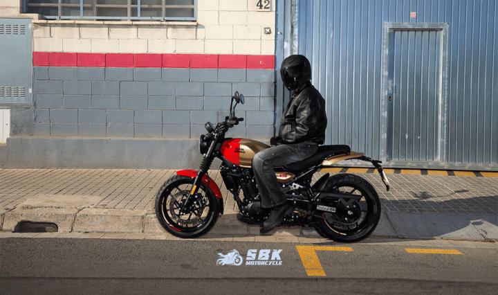 Wheels and Tires  The Guerrilla 450 rolls on 17-inch wheels fitted with wide-profile tubeless tires. The front tire measures 120/70 R17, while the rear tire is 160/60 R17. These tires offer excellent grip and stability, ensuring that the bike remains composed at all speeds and in various riding conditions.  Advanced Features  The Guerrilla 450 is packed with advanced features that enhance the riding experience. The Tripper TFT Cluster is a notable highlight, offering access to music, messages, maps, and more without the need to take your phone out. This display integrates Google Maps and is powered by a 2.4/5 GHz Wi-Fi 5 chipset, ensuring connectivity on the go.